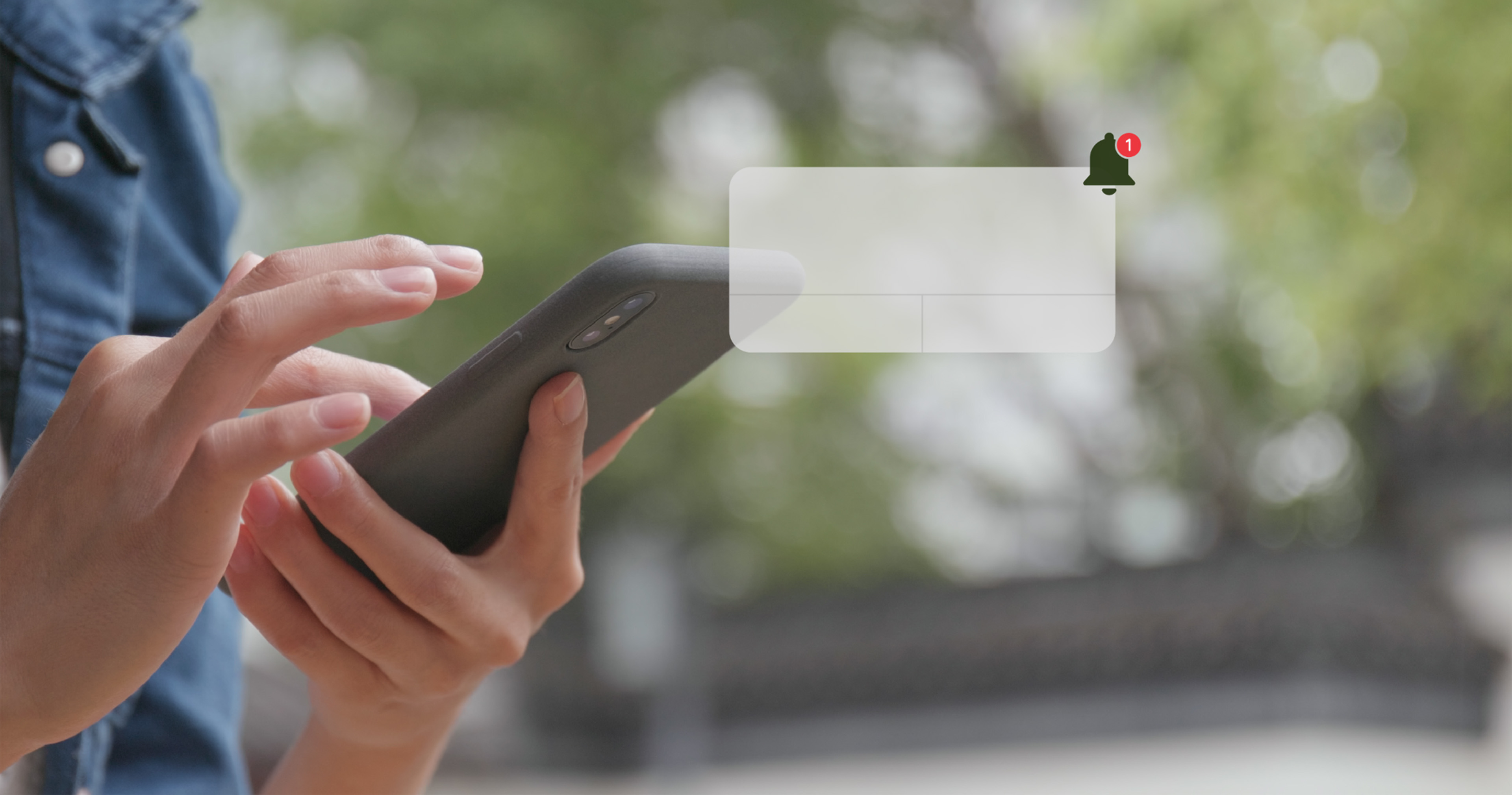 A person receiving a camera notification on a smartphone