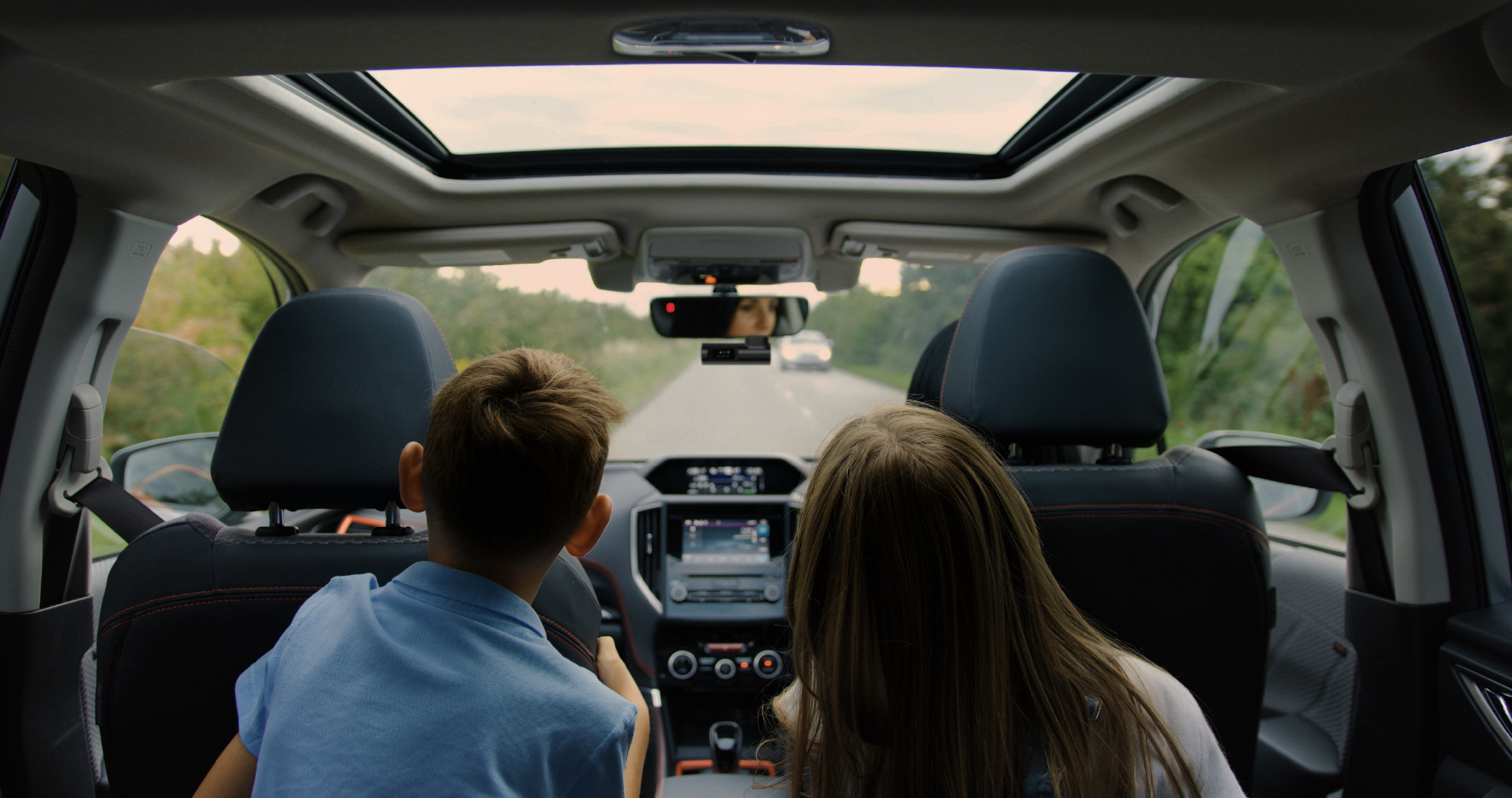 Passengers and front dash camera inside a car