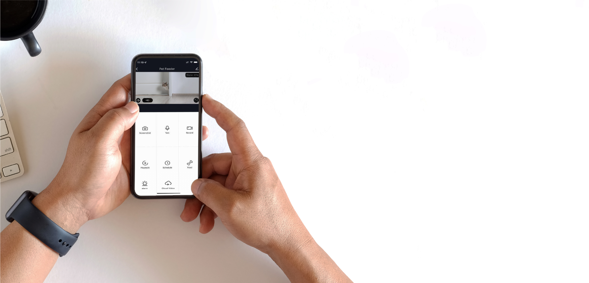 Hands using the smart pet feeder application