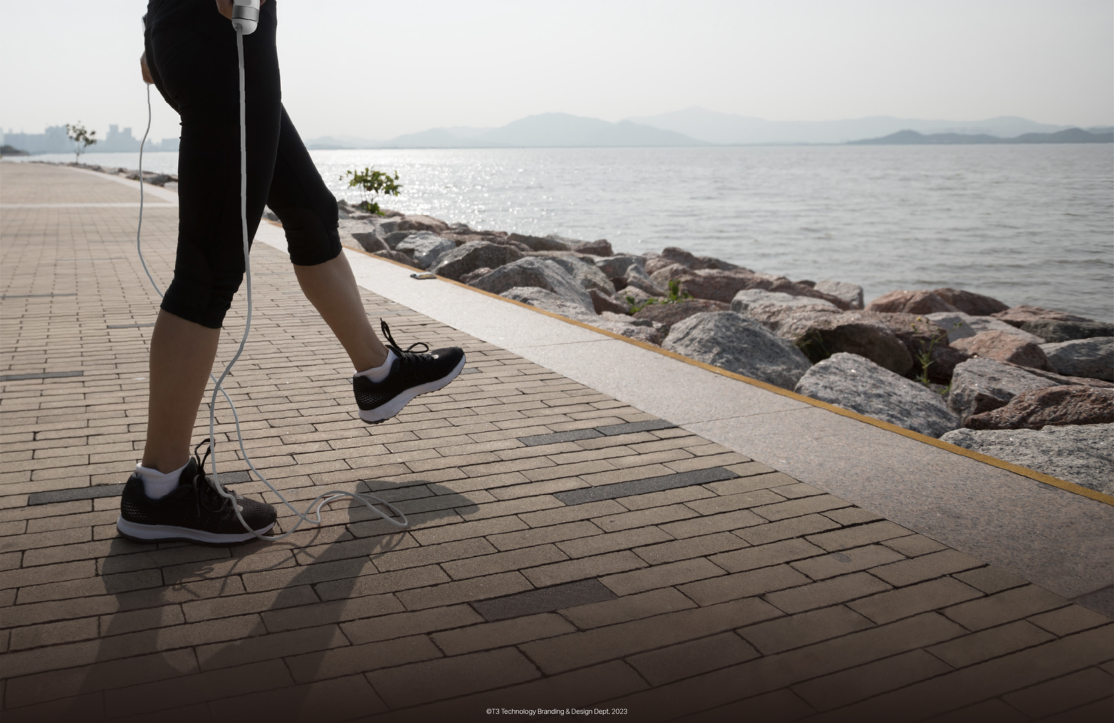 Outdoor jump rope lifestyle scene by the waterfront
