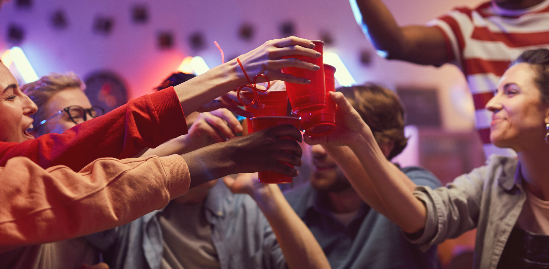 Friends raising their drinks at a party